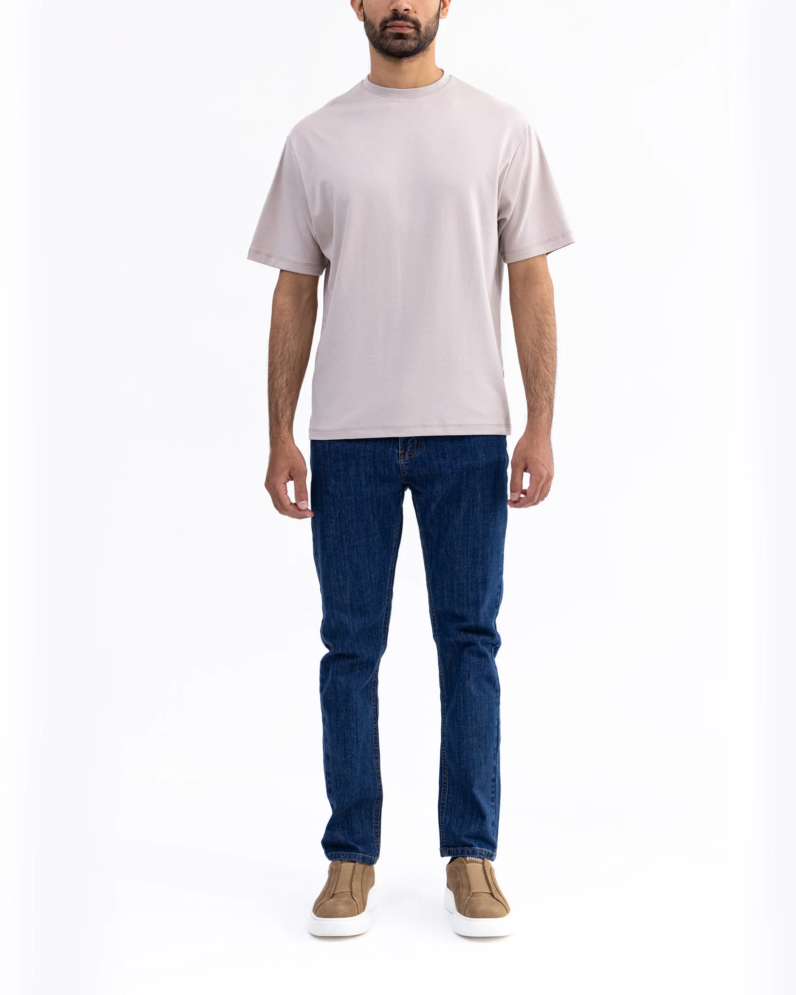 Men wearing a premium organic cotton T-shirt in a casual outdoor setting