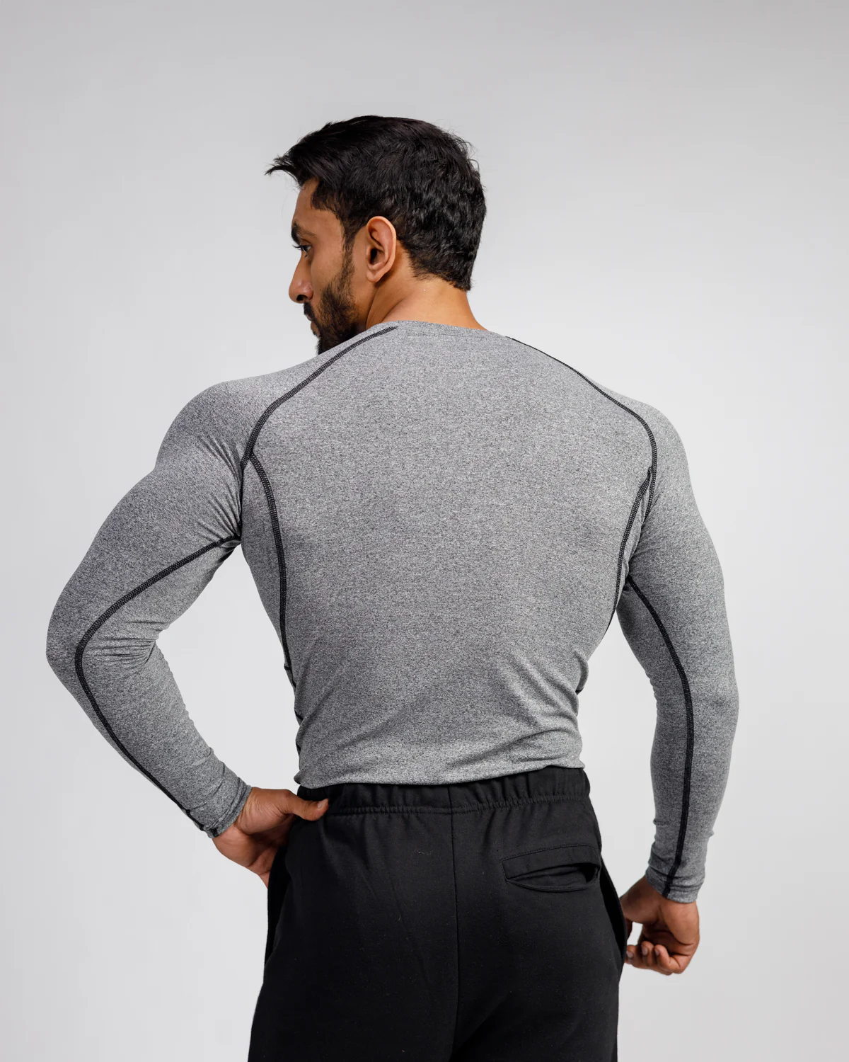 Men's Compression Top in breathable, moisture-wicking fabric enhancing athletic performance.