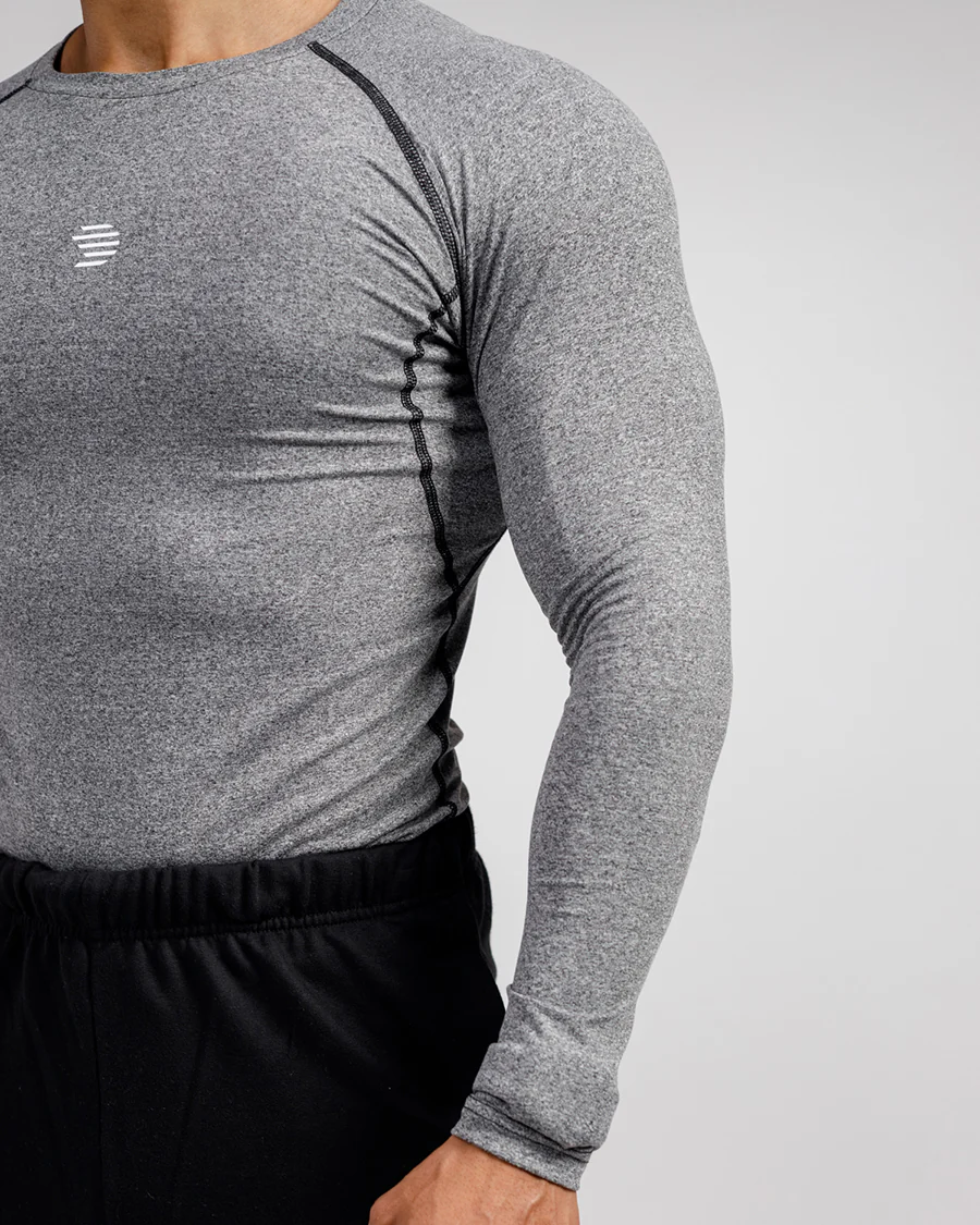 Men's Compression Top in breathable, moisture-wicking fabric enhancing athletic performance.