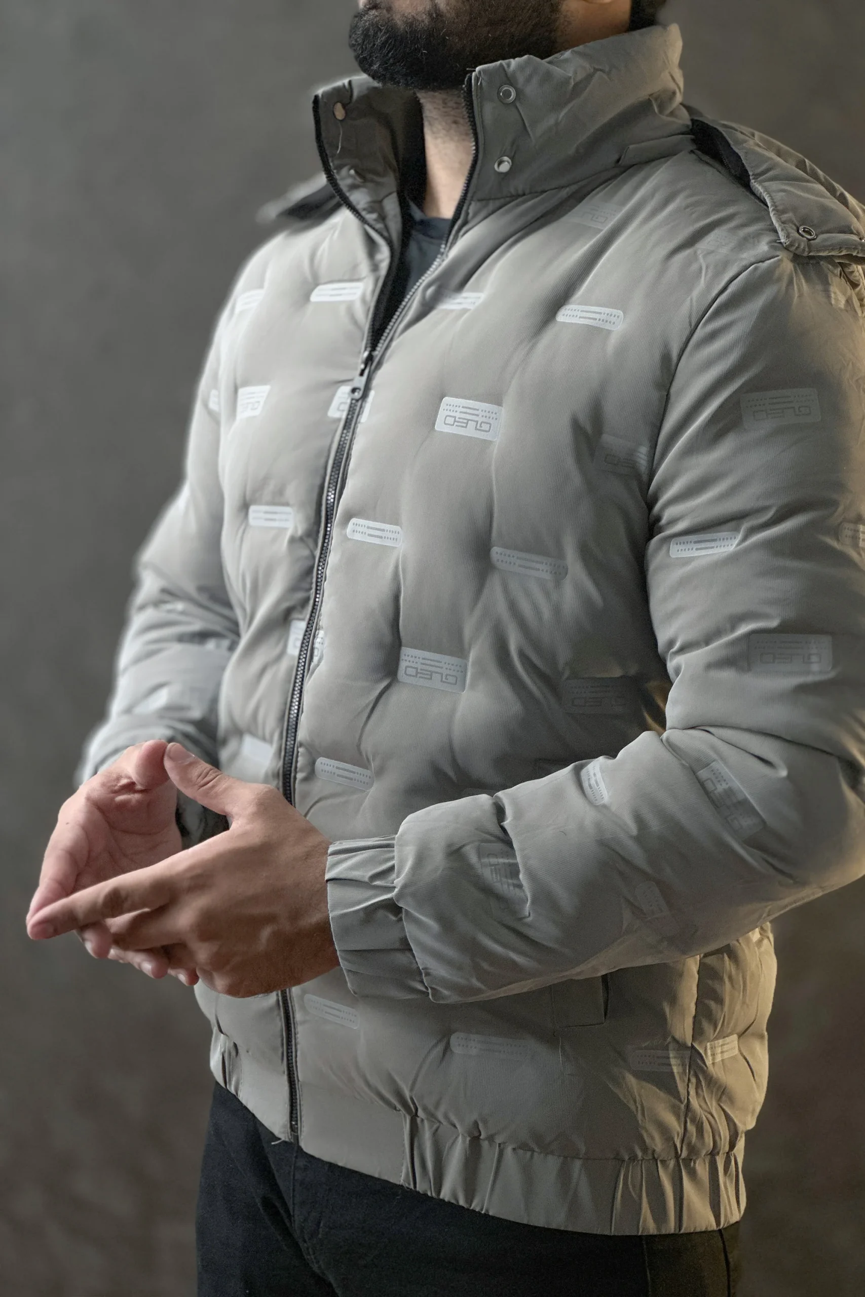 Men wearing a premium insulated puffer jacket showcasing its waterproof and windproof features.