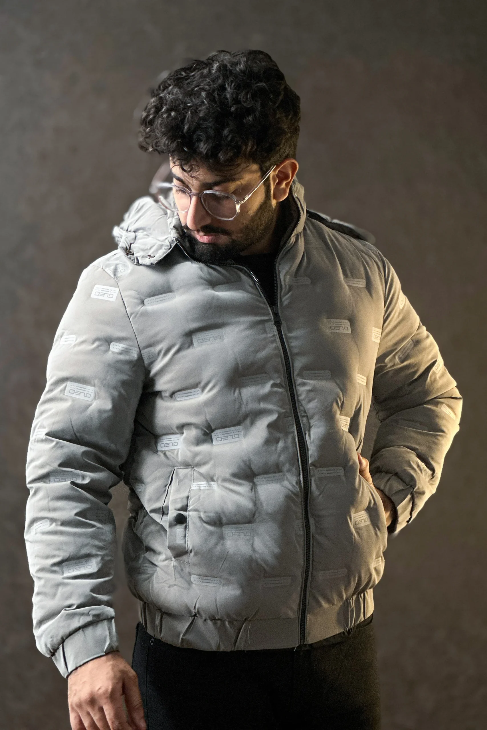 Men wearing a premium insulated puffer jacket showcasing its waterproof and windproof features.
