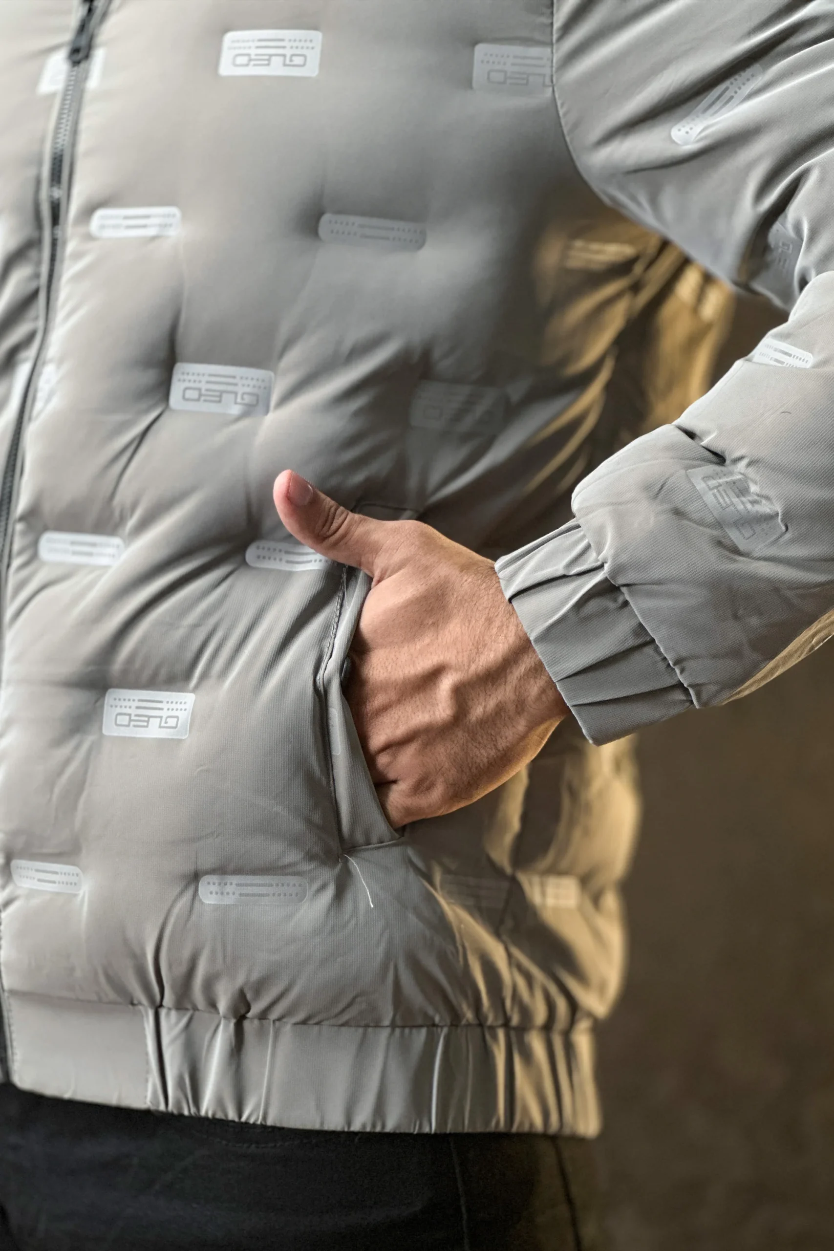 Men wearing a premium insulated puffer jacket showcasing its waterproof and windproof features.