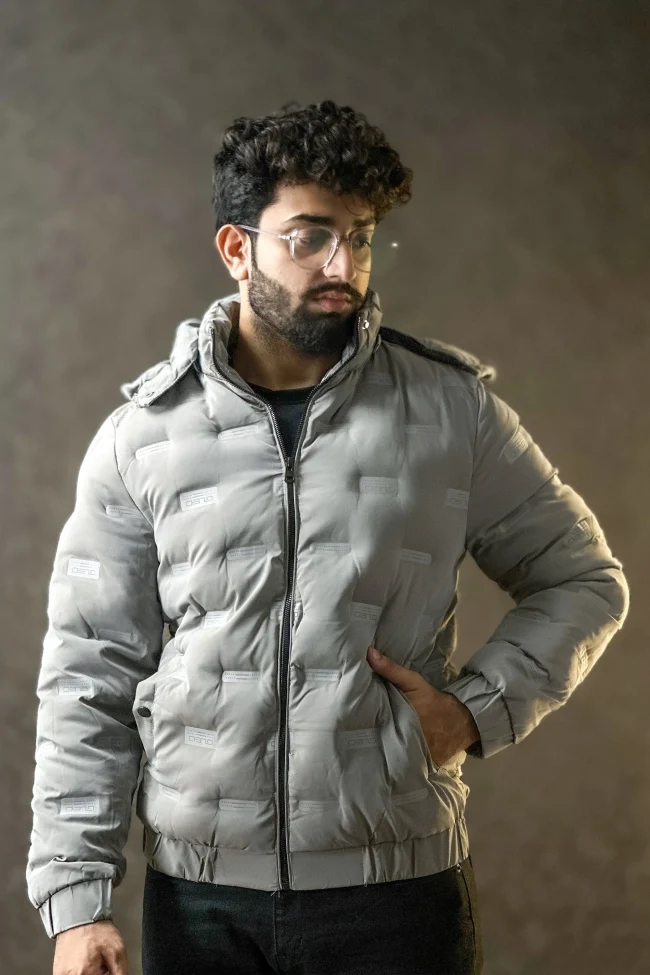 Men wearing a premium insulated puffer jacket showcasing its waterproof and windproof features.