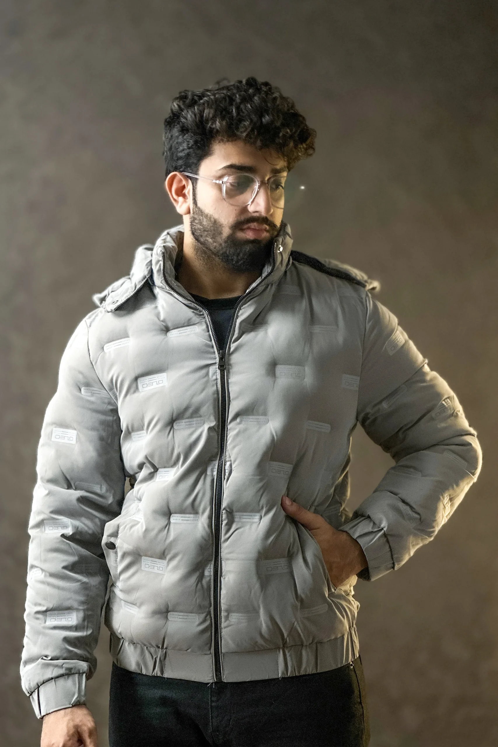 Men wearing a premium insulated puffer jacket showcasing its waterproof and windproof features.