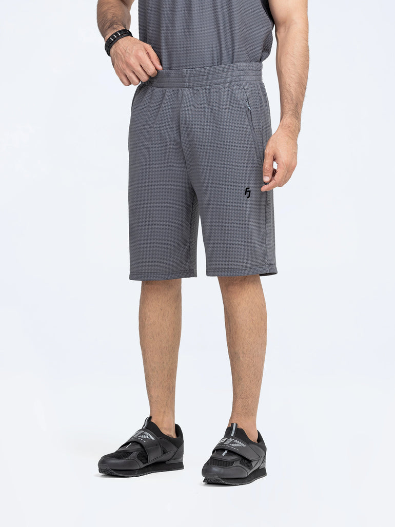 Men's Performance Gym Shorts in lightweight, quick-dry fabric with 5-inch inseam, elastic waistband, and zippered pockets.