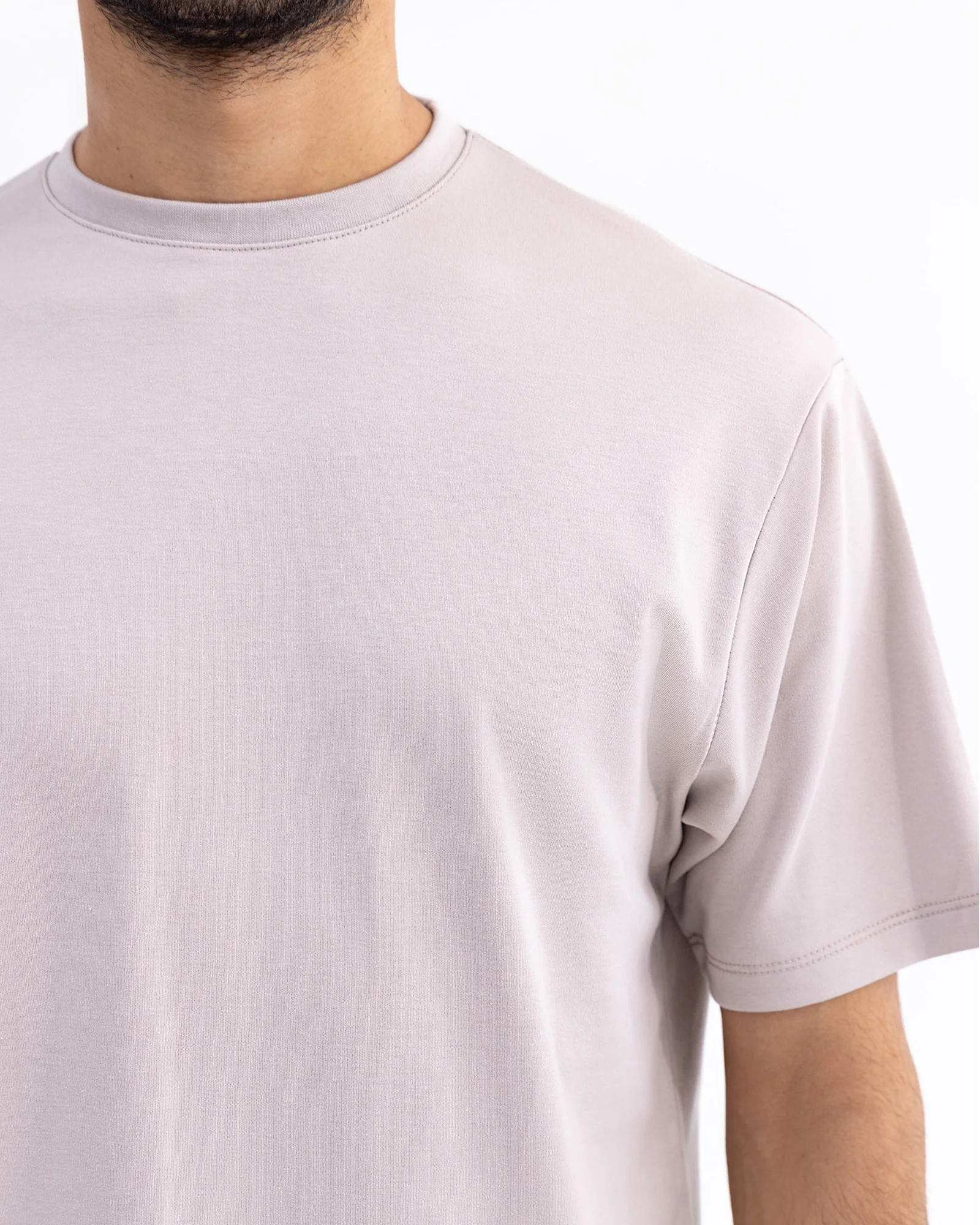 Men wearing a premium organic cotton T-shirt in a casual outdoor setting