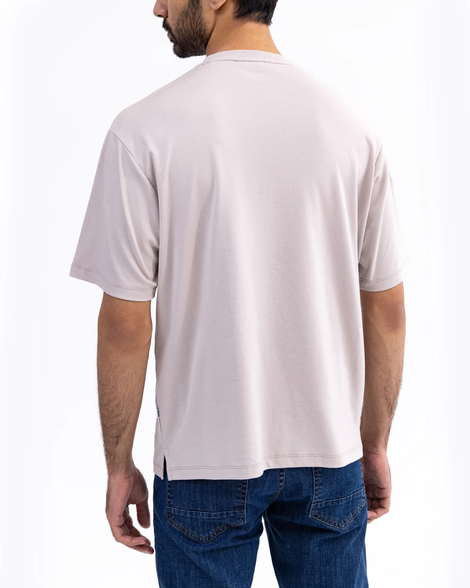 Men wearing a premium organic cotton T-shirt in a casual outdoor setting