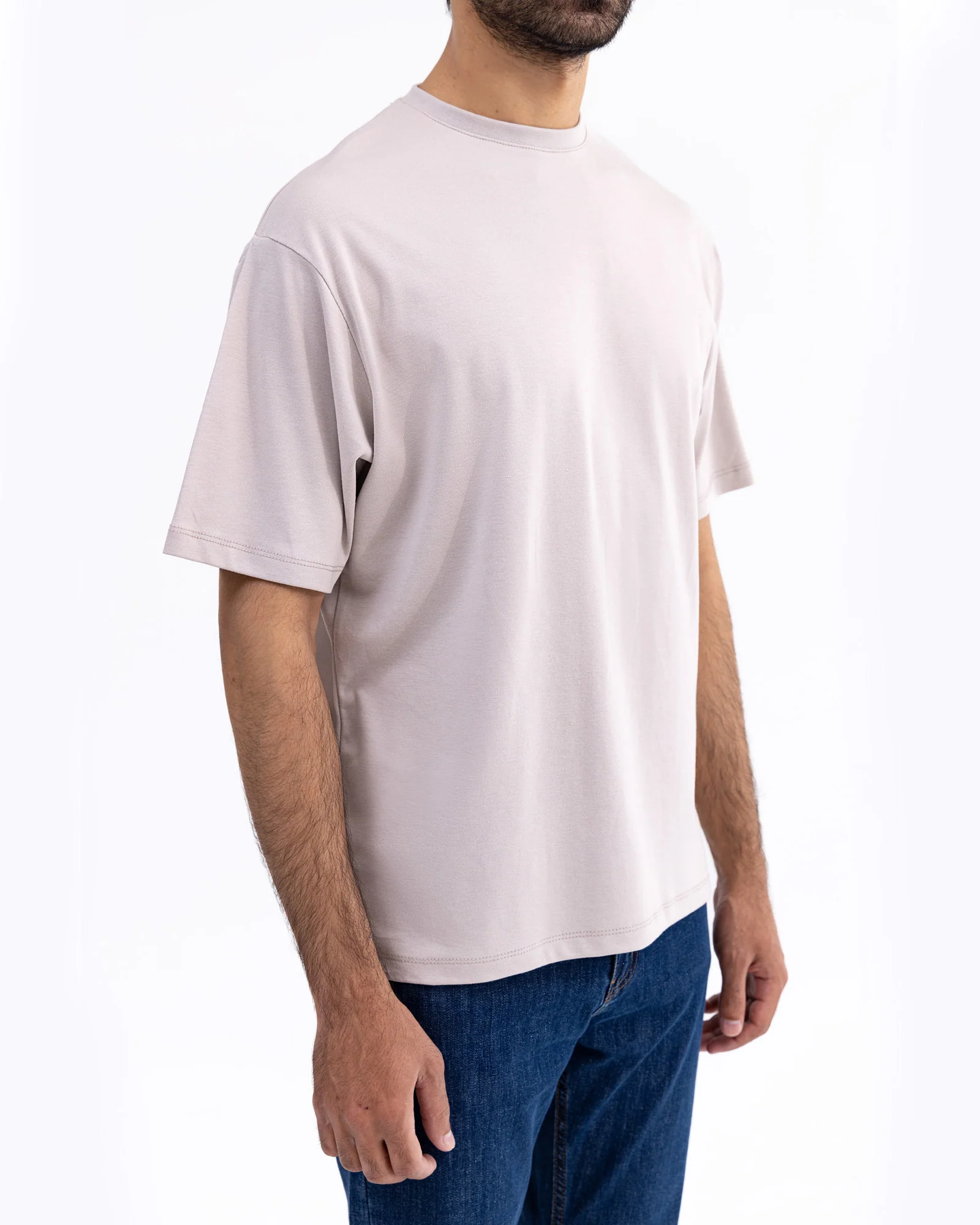 Men wearing a premium organic cotton T-shirt in a casual outdoor setting