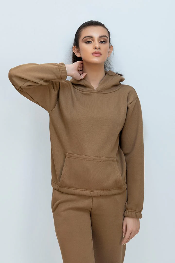 Woman wearing a stylish and comfortable premium tracksuit set, perfect for workouts and casual wear.