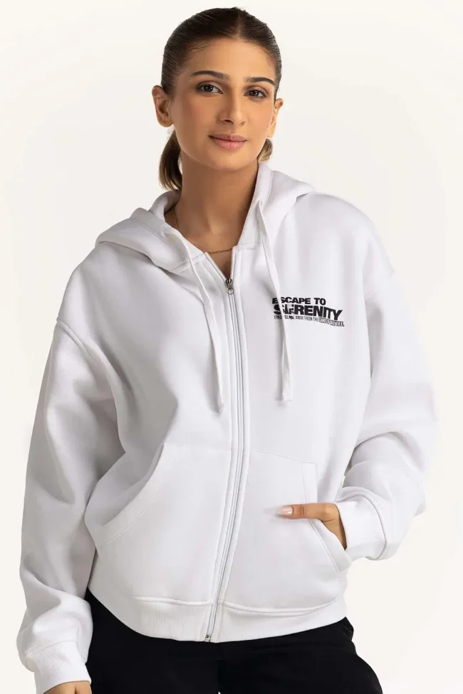 Model wearing a Women's Oversized Hoodie in heather gray, showcasing the relaxed fit and kangaroo pocket.
