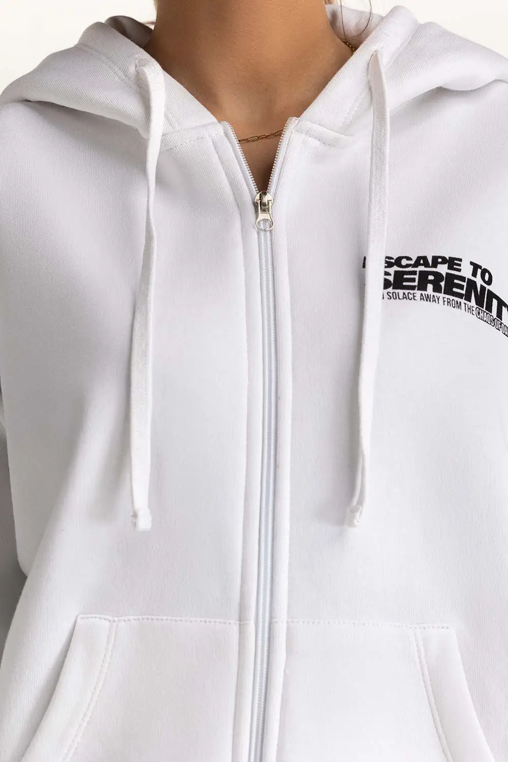 Model wearing a Women's Oversized Hoodie in heather gray, showcasing the relaxed fit and kangaroo pocket.